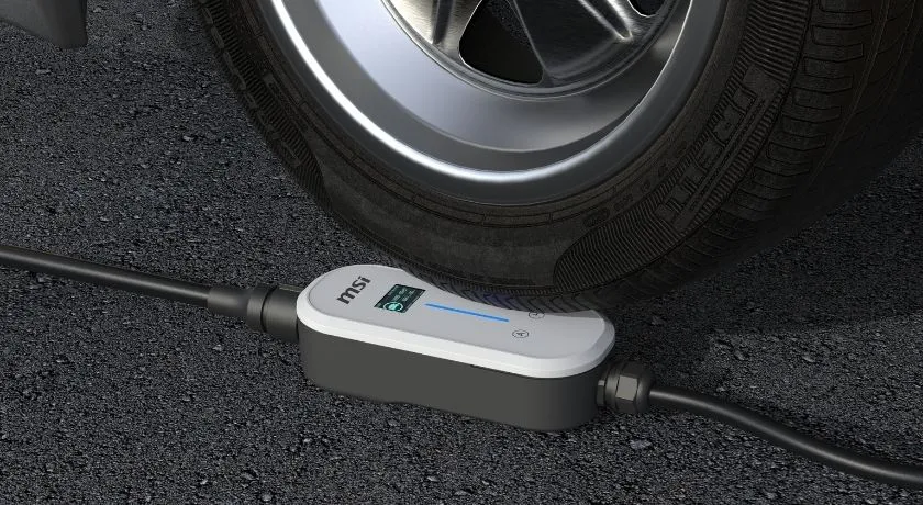 A fleet driver checks the state of his vehicle as it charges up